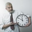 Man holding large clock