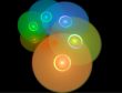 Abstract Colorful Spiral of Compact Discs Against Black Backgrou
