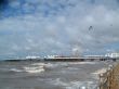 Seagulls Over Sea at Blackpool with Pier in Distance
