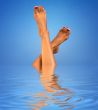 legs in blue water