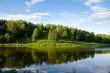 Blue reflection in river  at summer forest, Russia