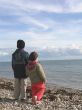 Boy and Girl on a Beach in Winter