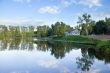 Blue square pond with reflections, summer, Moscow