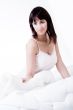 On my bed in my nightgown