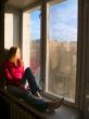 Woman near window