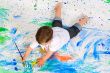 Boy playing with painting