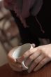 Woman hands with cup of coffee