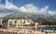 Beach with umbrellas in a kind of mountains