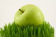 green apple on grass