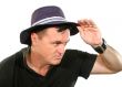 Man Looks Away In Hat