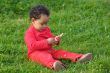 Baby playing on the grass