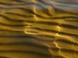 transparent water, waved sand & sun reflections