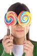 Girl eating two lollipops