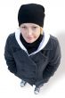 girl in cap, coat and gym shoes