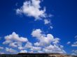 white clouds blue clear sky sun