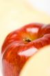 one red apple with yellow backgounds