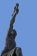 Triumph. Statue of a man with a torch