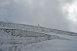  One man trekking  on a glacier.