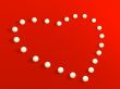 3D heart from pearls, on a red velvet