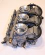 3 carburetors of a motorbike