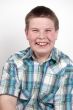 young boy laughing out loud