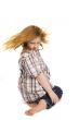 little girl swinging her hair