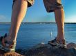 Man standing on Rocks near Sea