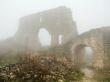 age-old stronghold gate arched mist morning