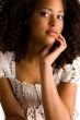 African woman with a hand on her chin