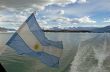 Argentina Flag, lake Argentino and mountains