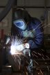 Welding welding a metal part in an industrial environment
