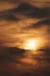 Sun behind the clouds