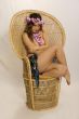 Girl in wicker chair hawaiian lay
