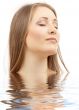 beautiful woman with closed eyes in water