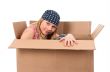 Girl hiding in a cardboard box