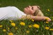 Woman lying on grass