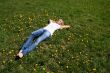 Woman lying on grass