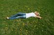 Woman lying on grass