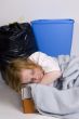 homeless kid sleeping in a box