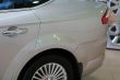 detail of new car in dealership showroom