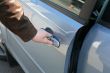man is open the door of new car