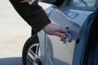 man is open the door of new car
