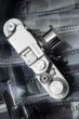 Vintage rangefinder camera from top over black and white film