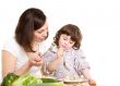 mother and daughter cooking at the kitchen