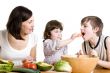 mother and children cooking at the kitchen