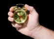 Alarm clock in a hand