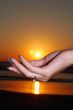 sun sunset on  hand