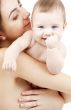 clean happy baby in mother hands