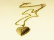 Gold chainlet with a coulomb in form heart