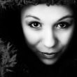 Young woman looking straight into the lens